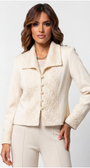 Woman wearing a cream-colored jacket with a textured pattern on a white background