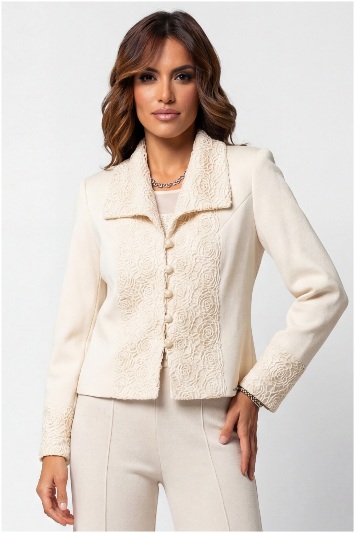 Woman wearing a cream-colored jacket with a textured pattern on a white background