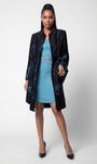 Teal Floral Jacquard Light Coat, Emma. Full length on the model over a light blue dress.