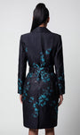 Teal Floral Jacquard Light Coat, Emma. Back view on the model, belted.